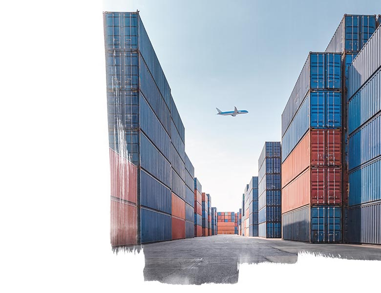 A plane above a port with containers